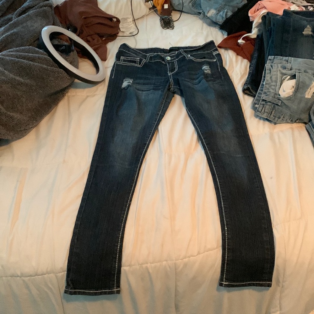 Cute dark blue jeans they are strait leg/ skinny jeans the back is super cute!